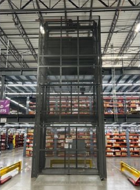 Photo of a Wildeck Vertical Reciprocating Conveyor being used for material transport as part of a mezzanine system.